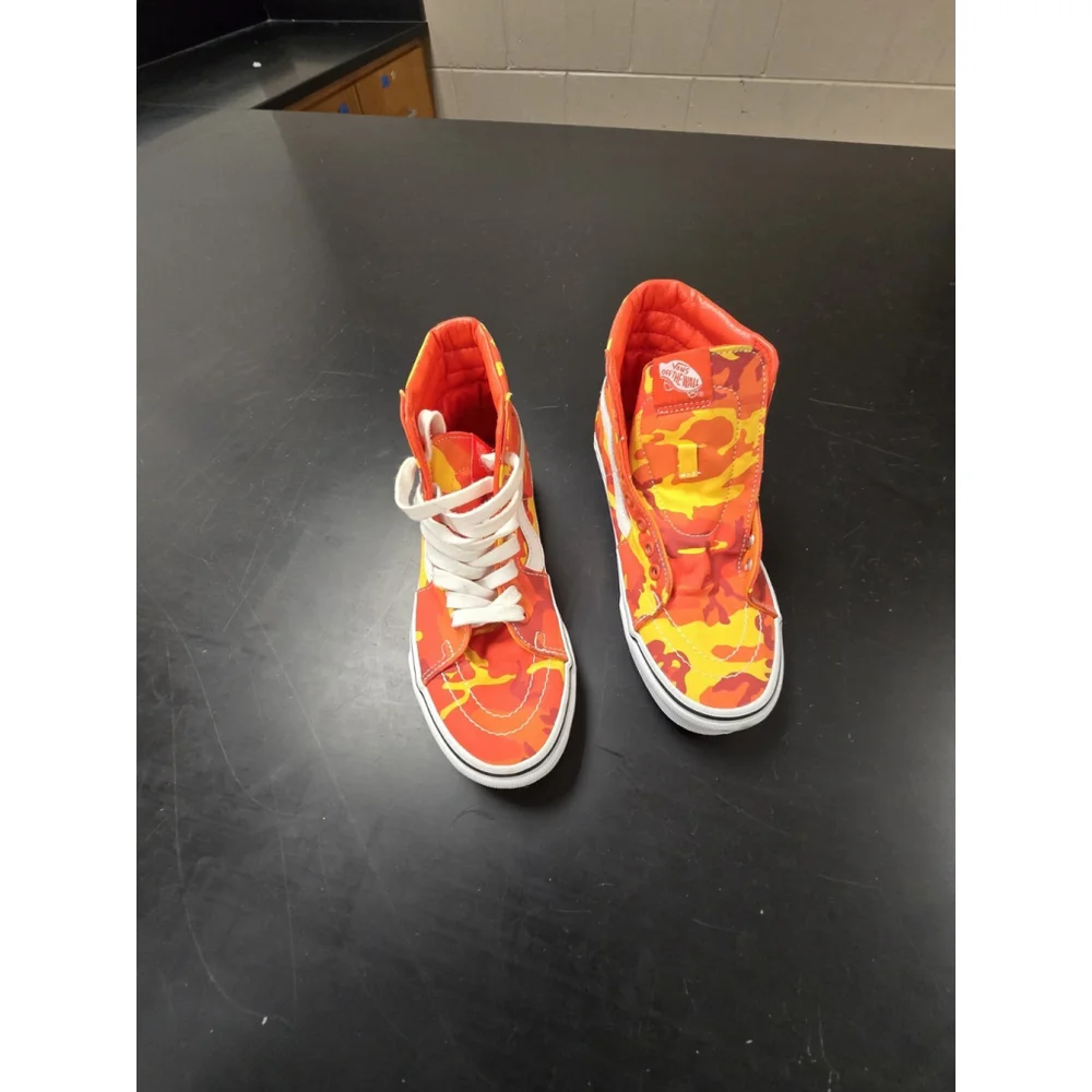 Vans Sk8-Hi high-top sneakers in an orange and yellow camouflage